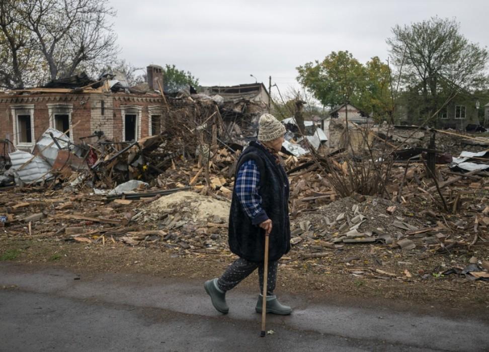 An older Ukrainian resident walks past destroyed homes following a Russian airstrike on Kramatorsk, Donetsk region, Ukraine on October 09, 2025