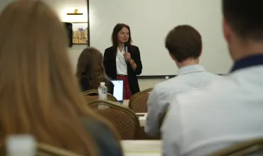 Head of Mission Bell speaks to students